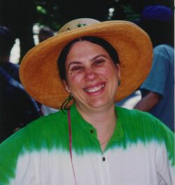 Flip Breskin in straw hat and green/white dress